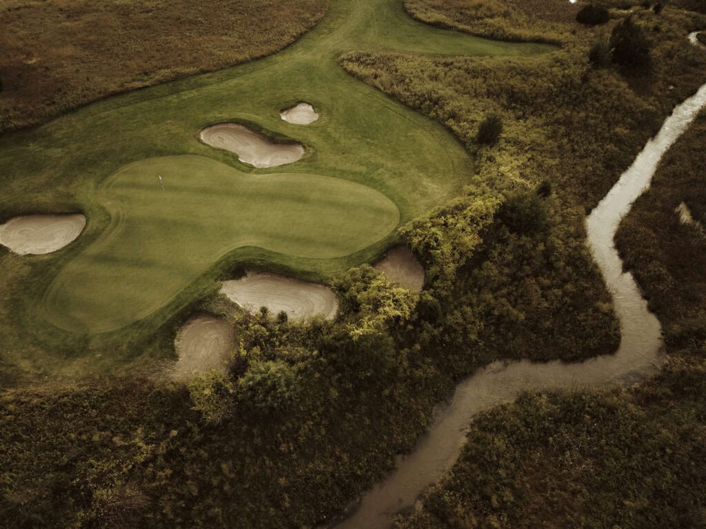 Aerial view of a Nebraska golf course with sand traps and water hazards.