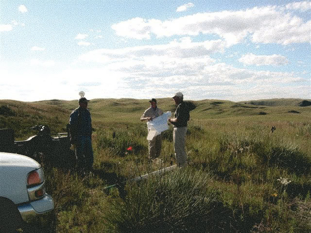 Three men preparing for a guided hunting trip in Nebraska's Sandhills.