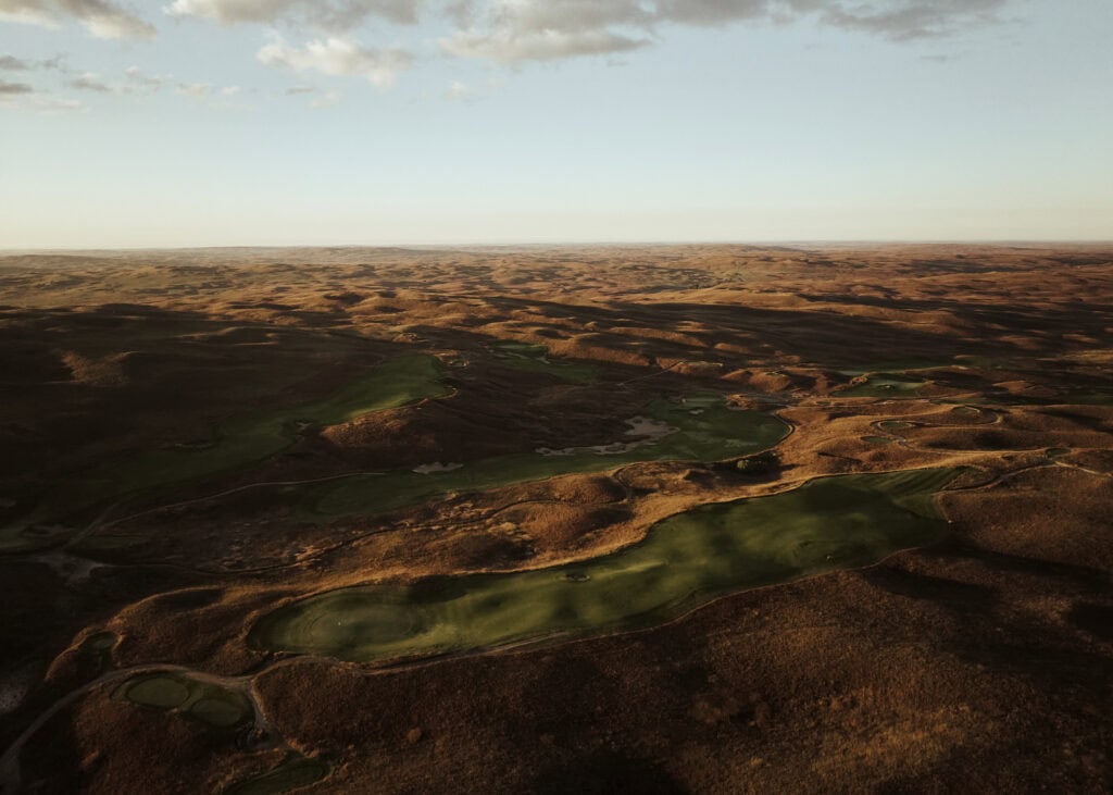 Aerial view of a golf course in Nebraska's Sandhills at sunset.